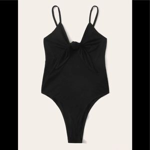 Black front tie bodysuit **never worn**
